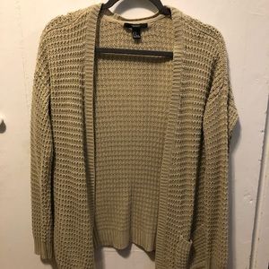Tan sweater. Pocket on one side